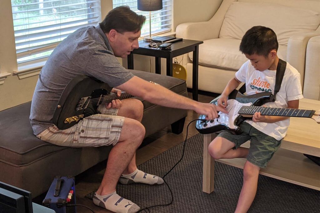 Student learning guitar