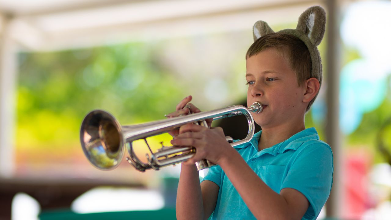 kid playing brass