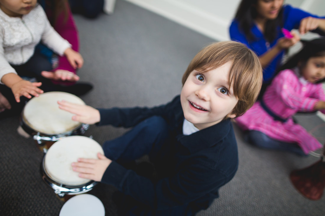 kid playing the drums at bucktown music