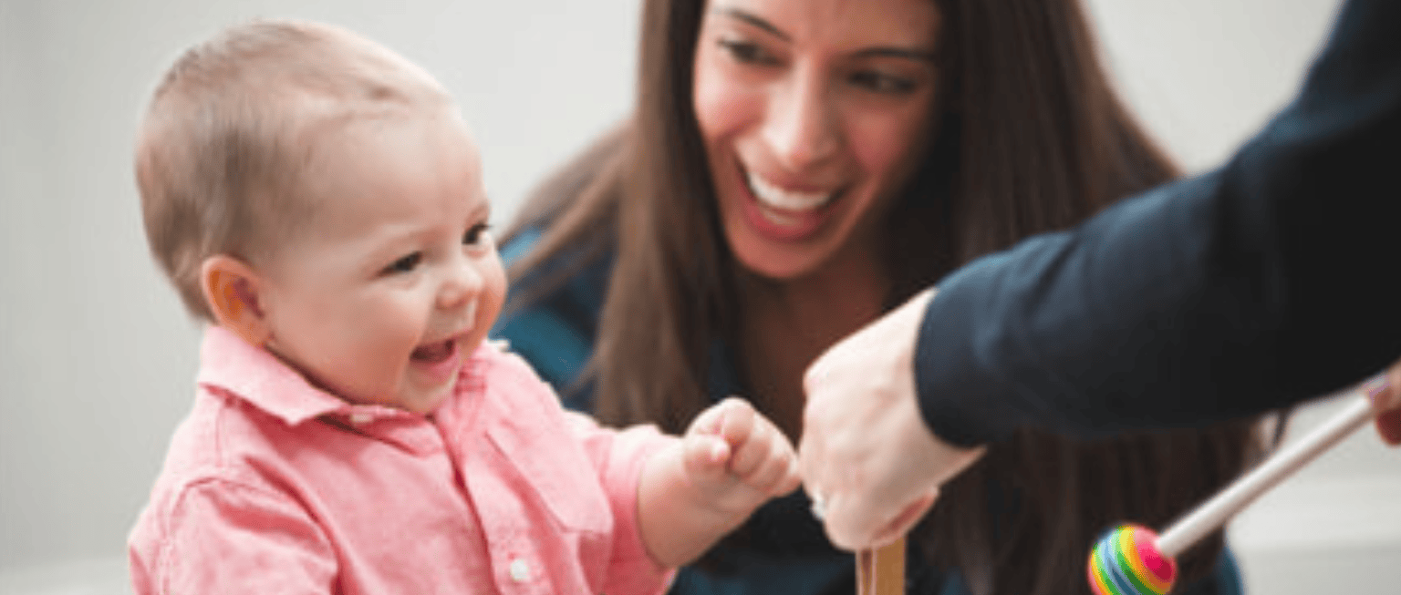 baby and the parent playing music