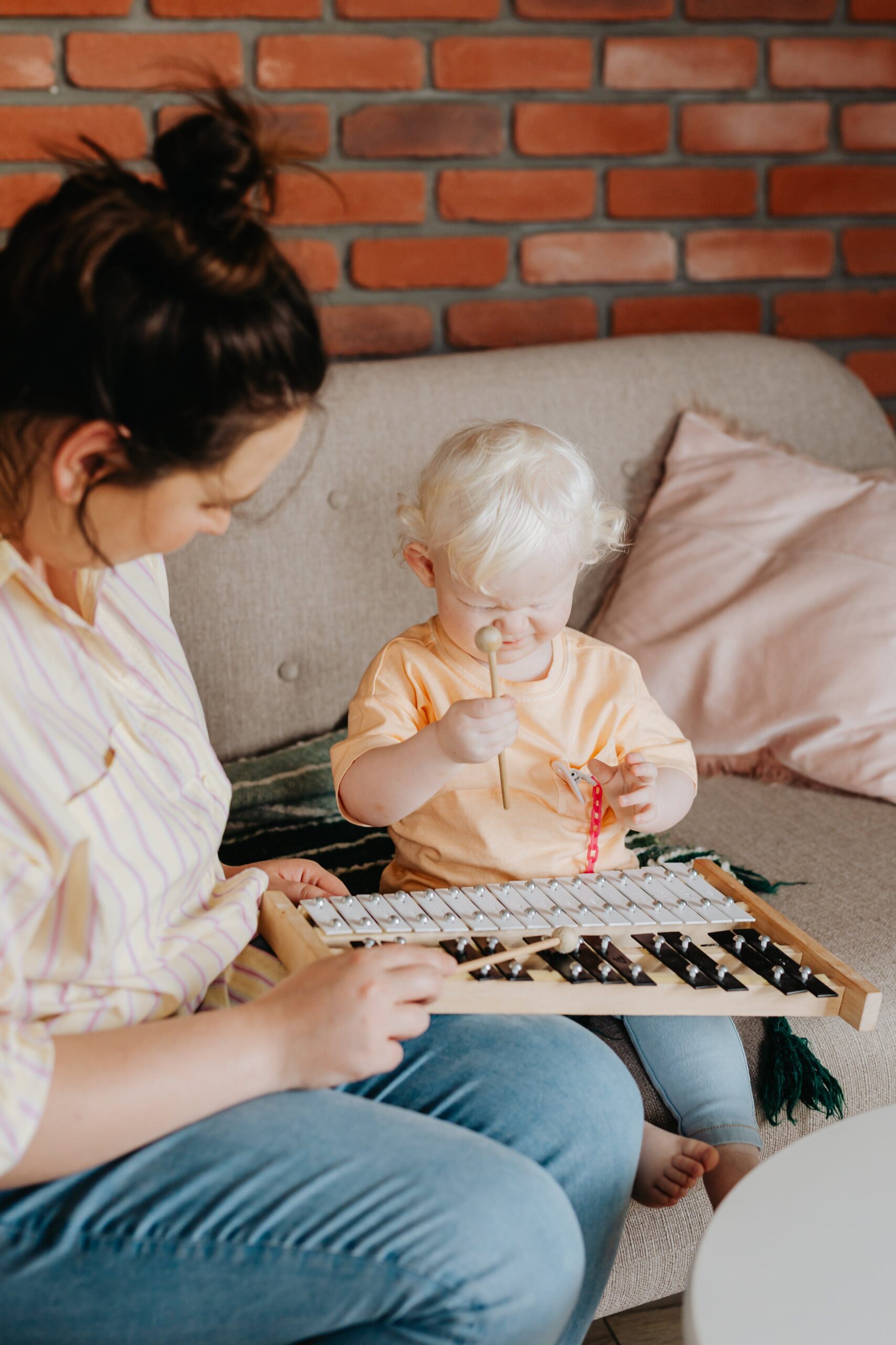 toddler playing the xylophone