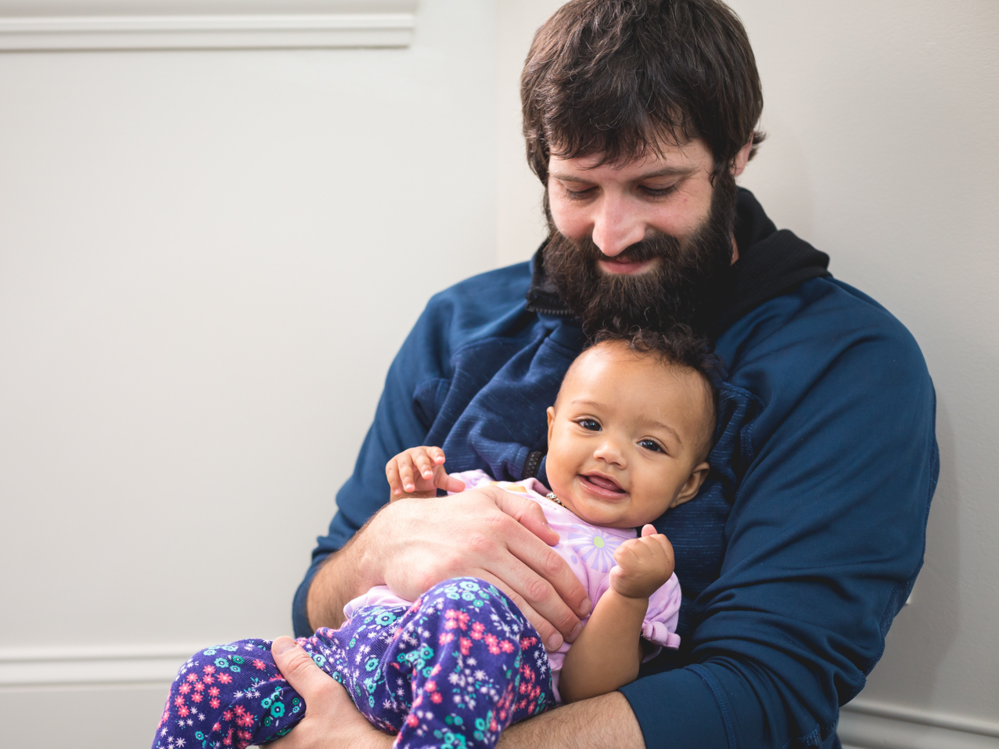 Man holding smiling baby