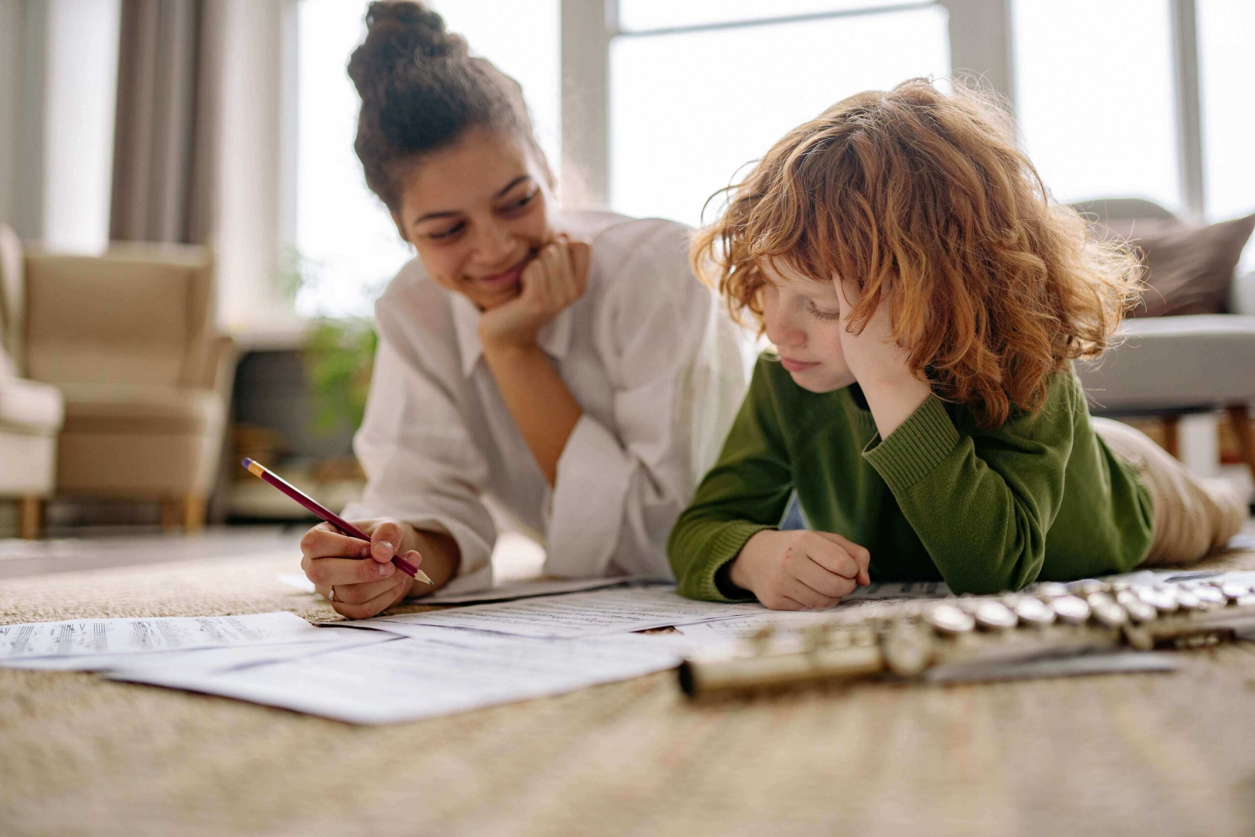 music teacher teaching the musical notes to the young kid