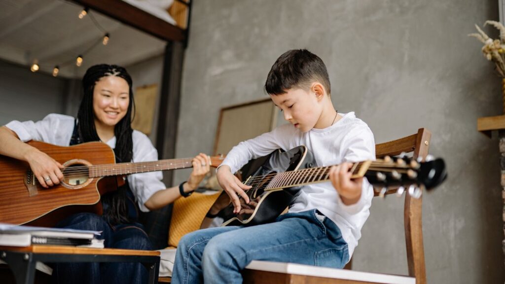 teacher and student studying music