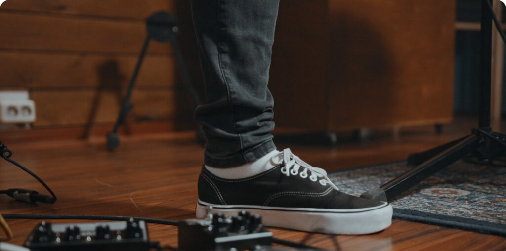 student with sound equipment on the floor