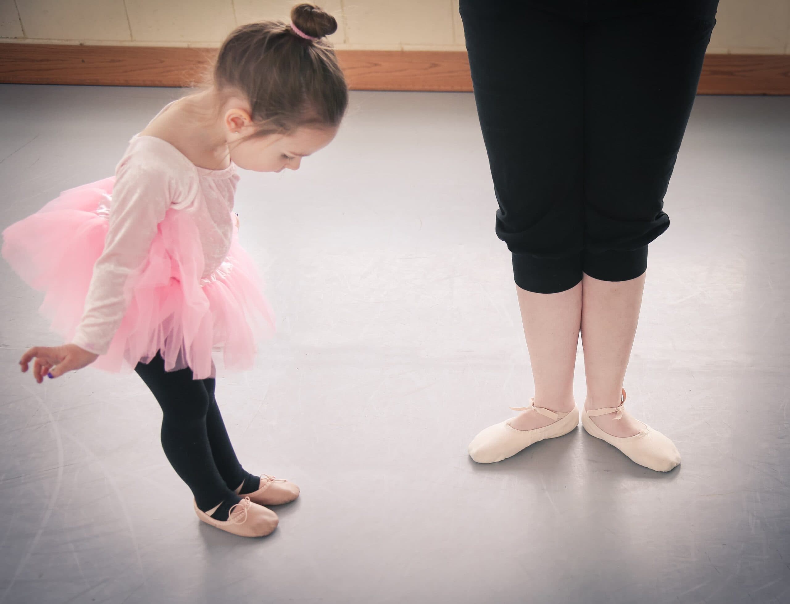 Little ballerina with teacher