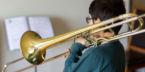 student playing the trombone