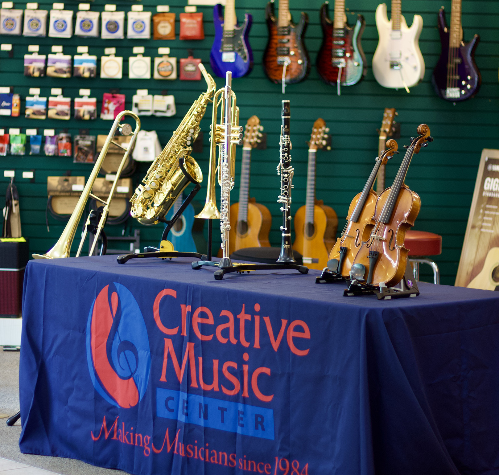 Display table at Creative Music with a sampling of musical instruments