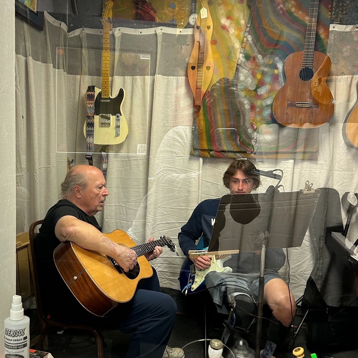 guitar teacher and his student