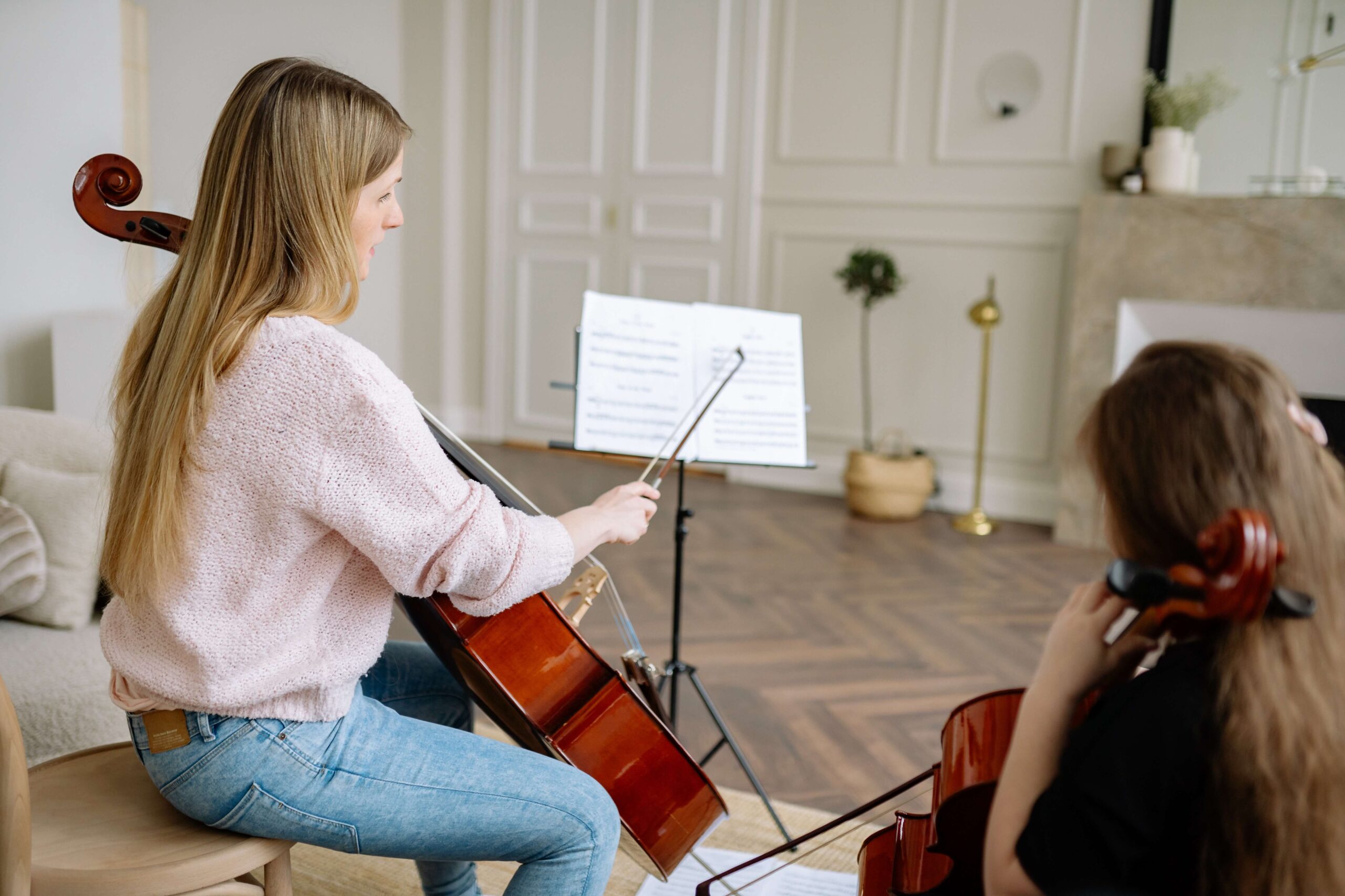 Woman teaching cello