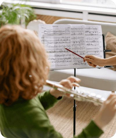 Woodwind teacher teaching woodwind to the young kid Danville CA