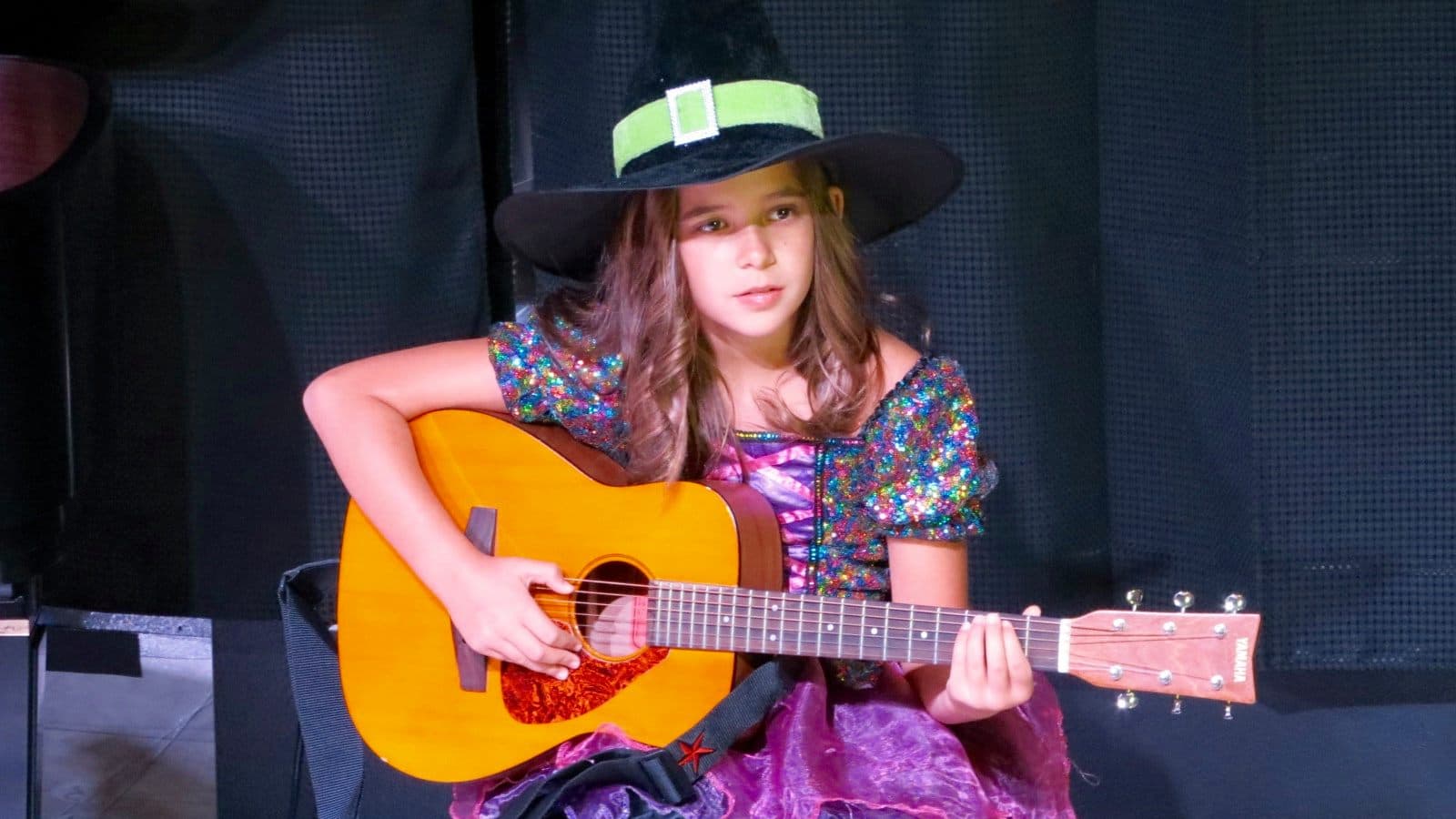 glee music student with her guitar