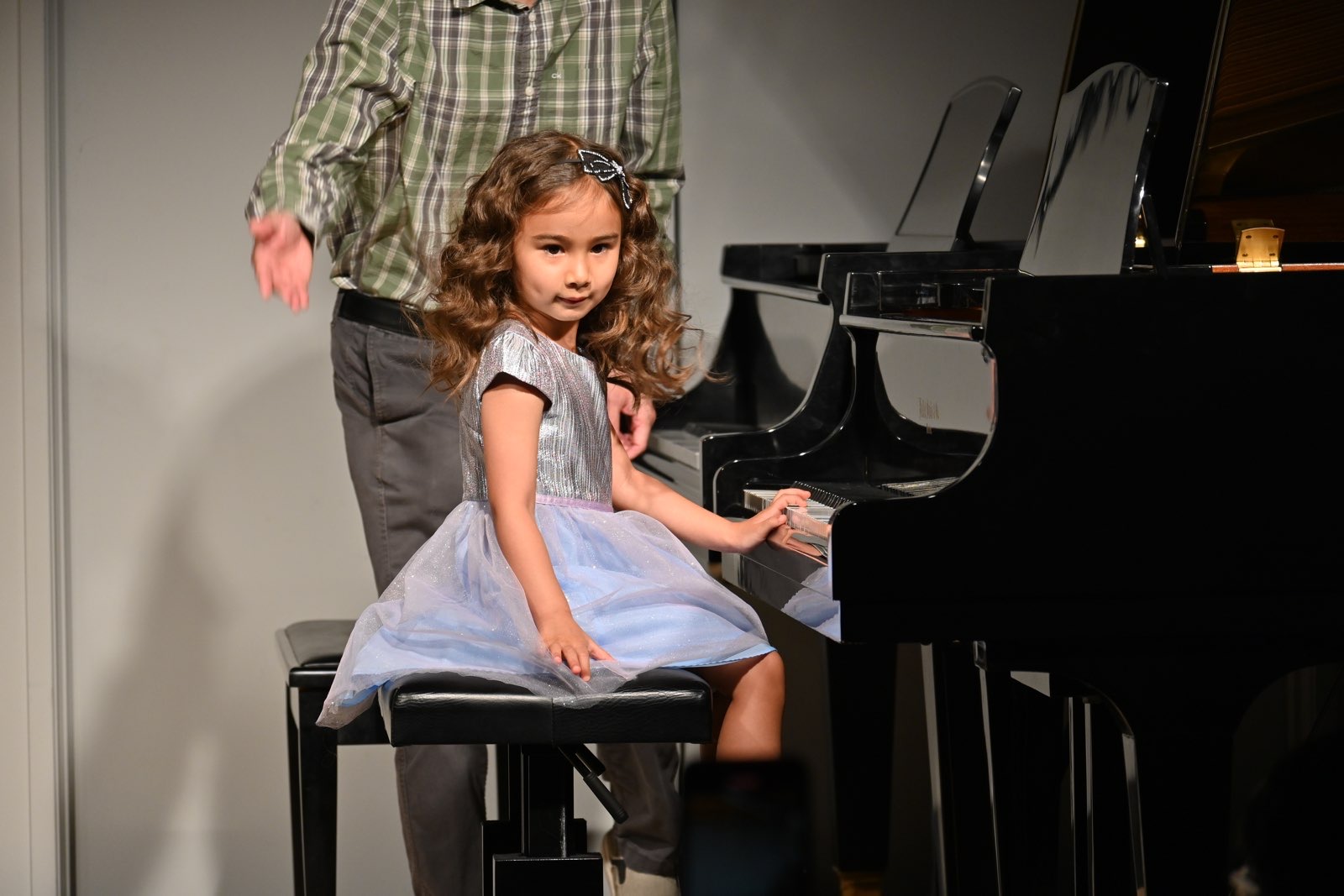 little girl playing the piano
