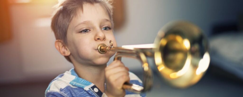 kid playing the trumpet