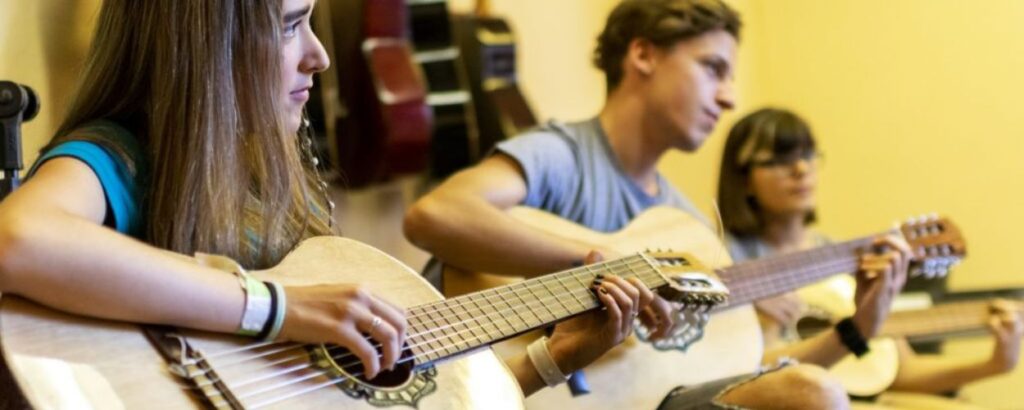 students playing the guitar