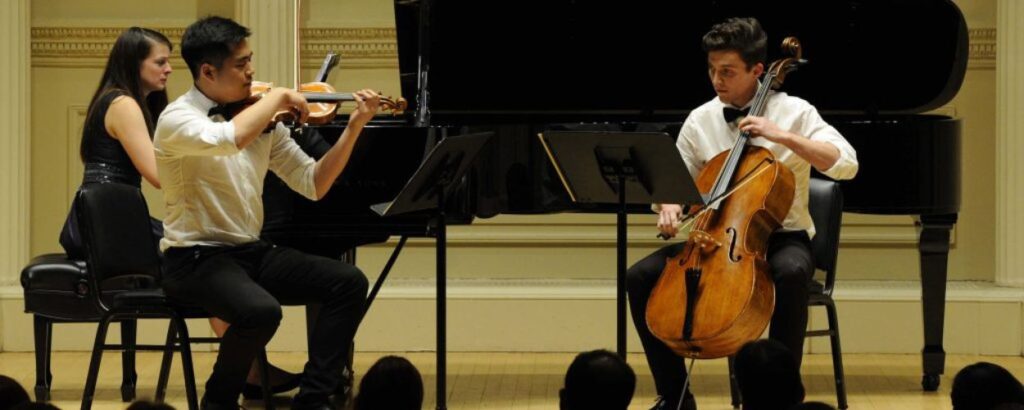 students playing violin cello and piano