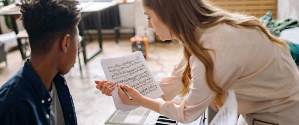 teacher doing at home piano lessons