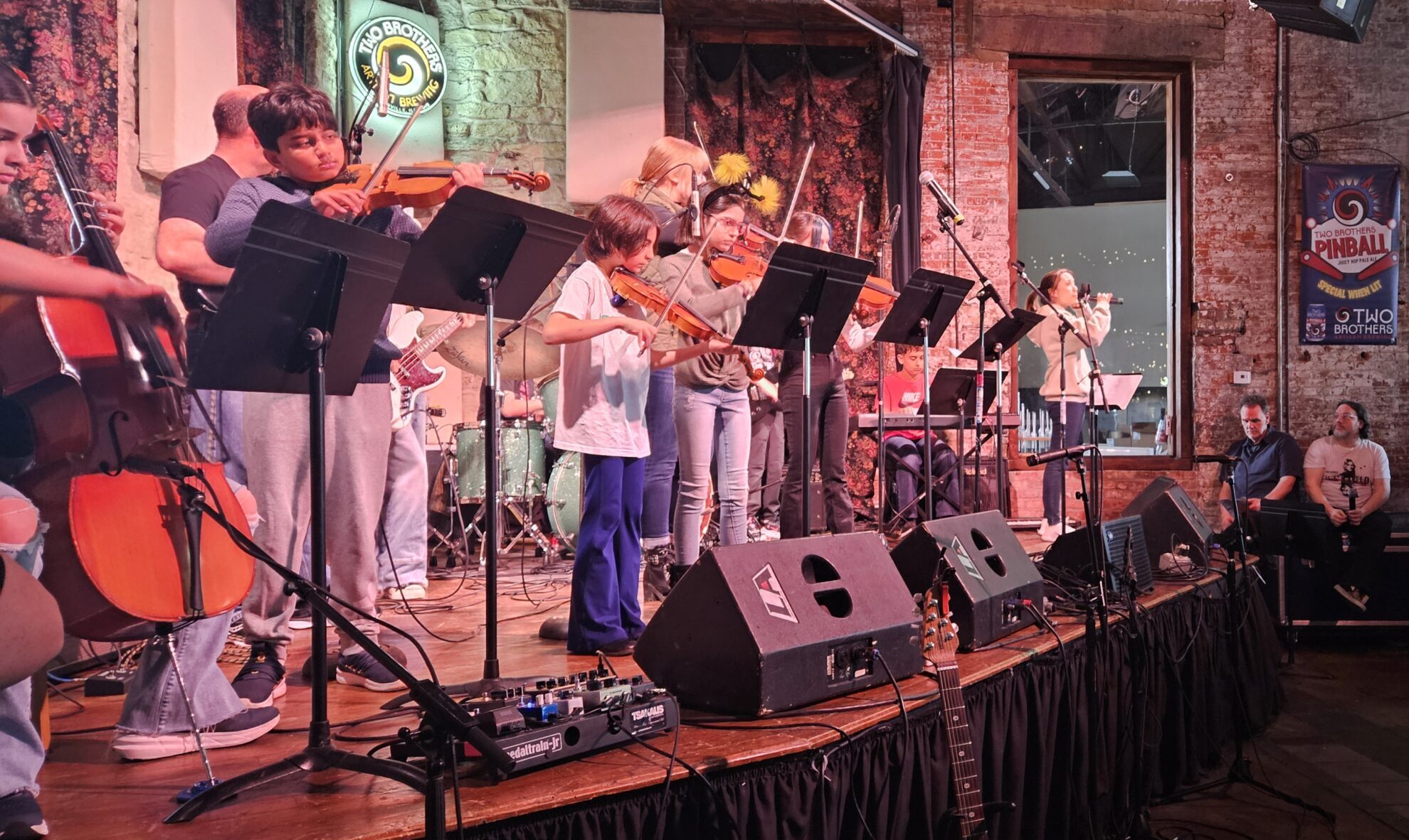 violin, viola and cello students performing on stage