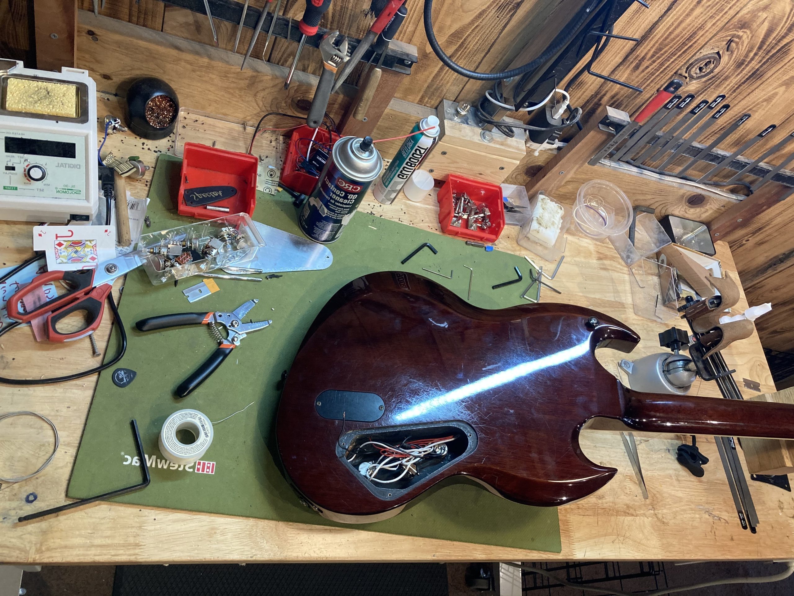 electric guitar being repaired