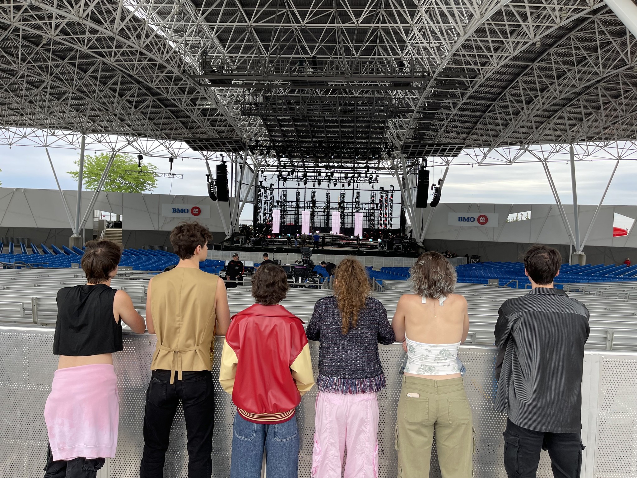 photo of SM6, a band of students, looking out towards an outdoor pavilion 