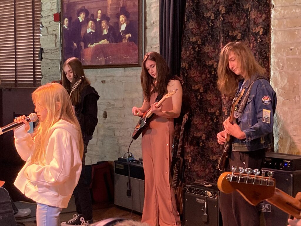 student performing on stage