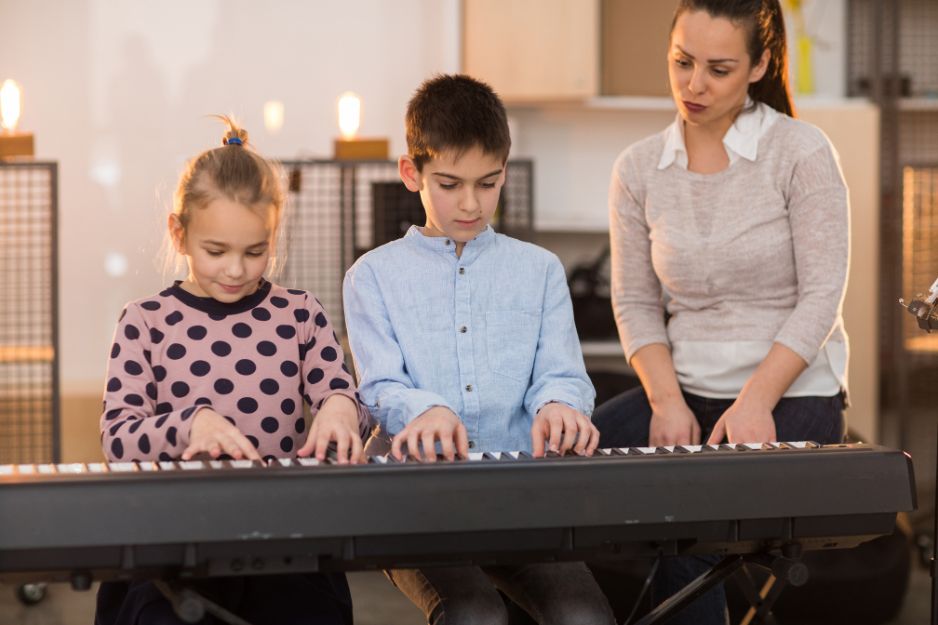 family music class playing the piano
