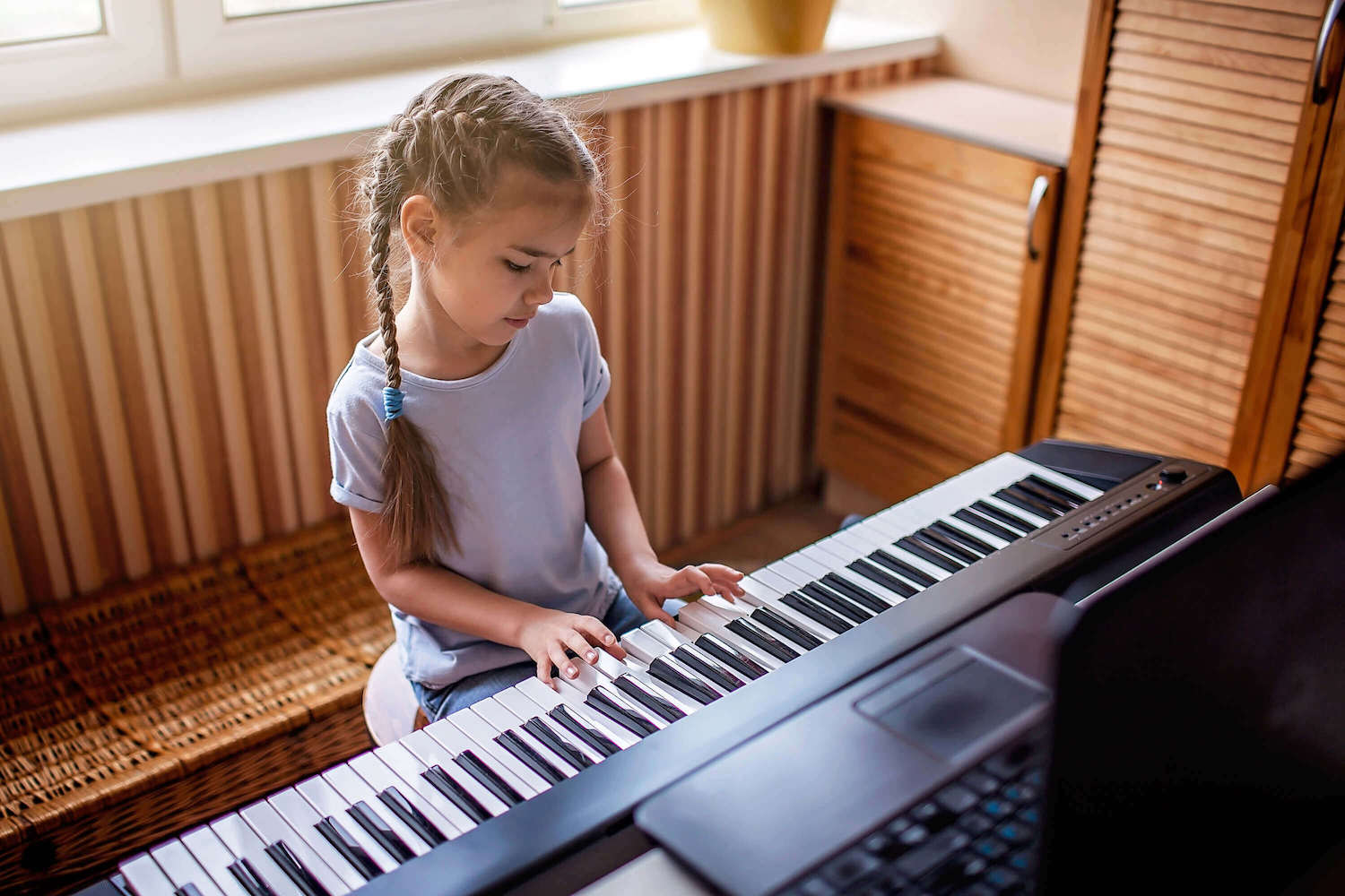 young student playing the piano in Lakewood OH