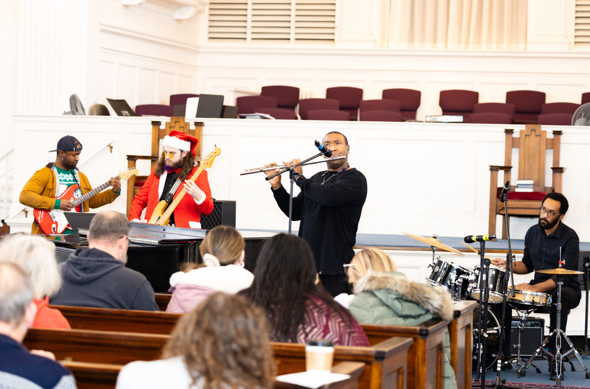 Teacher band playing with flute player in the middle