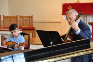 guitar teacher and student