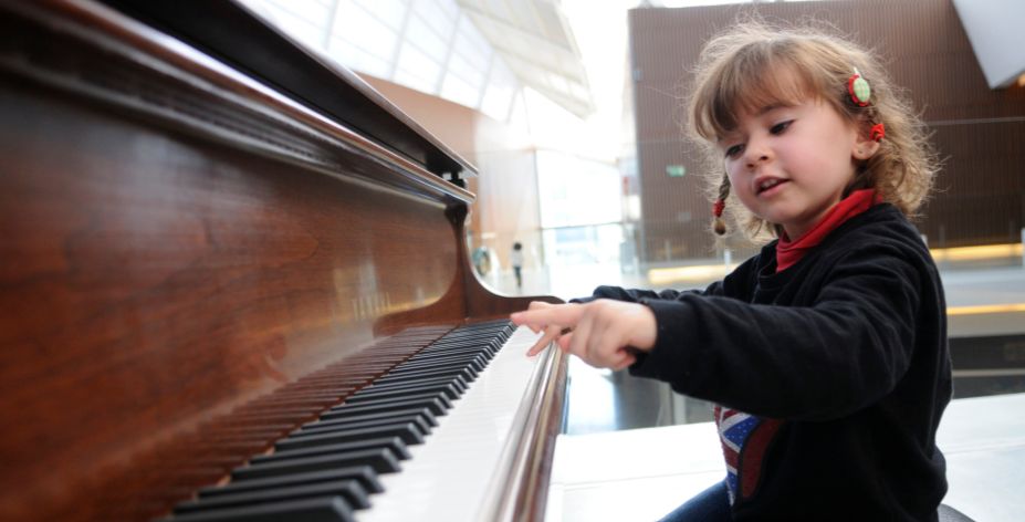 kid playing the piano