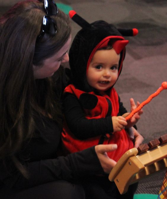 toddler learning to play music