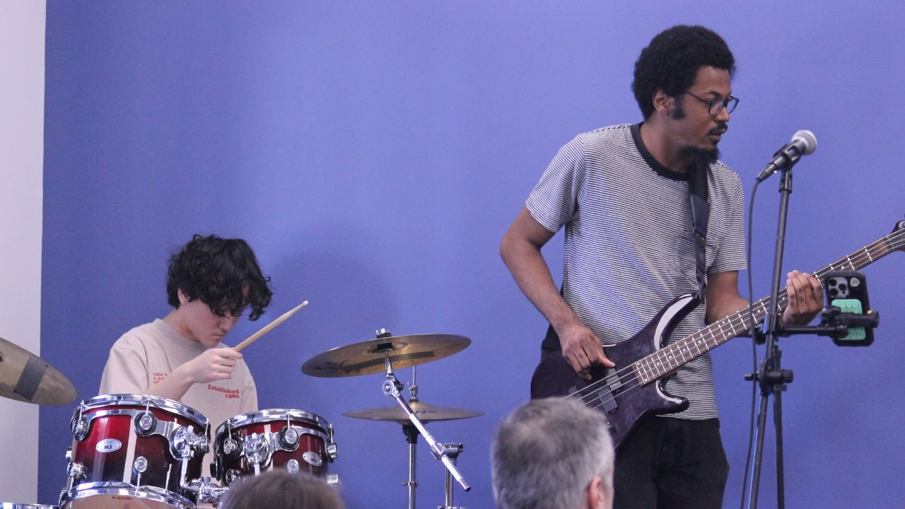 student playing drums