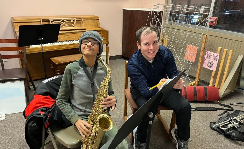 student learning how to play saxophone