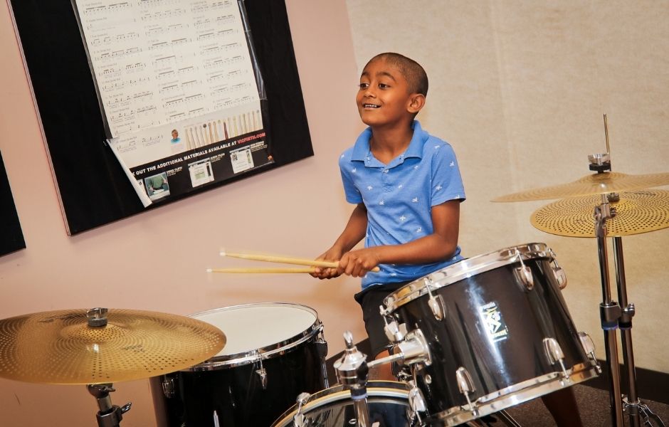 student playing the drums