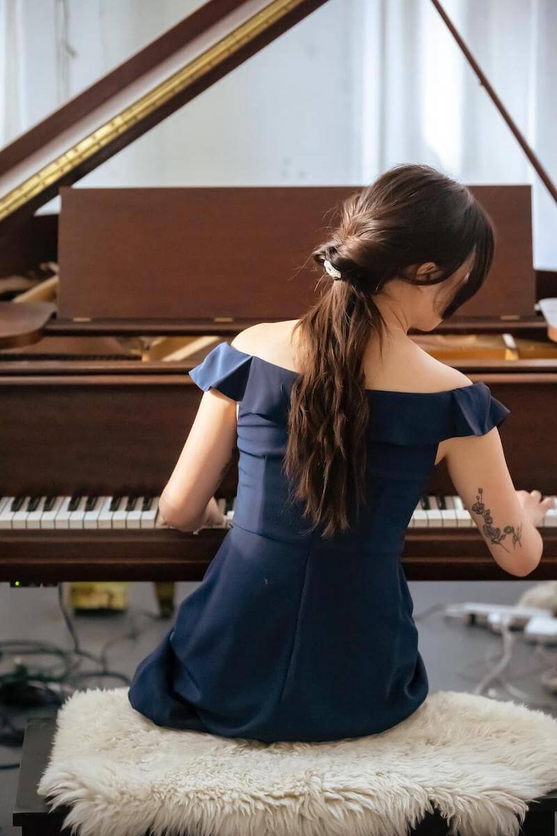 young student playing the piano