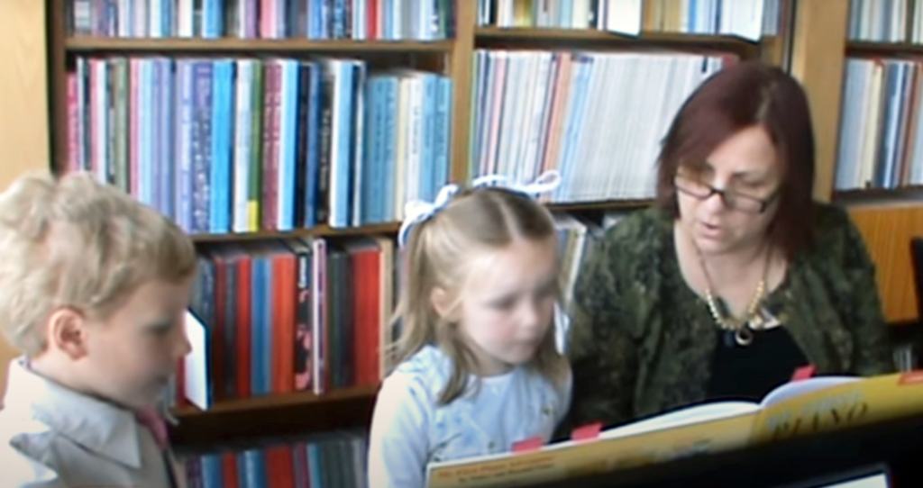student learning to play the piano