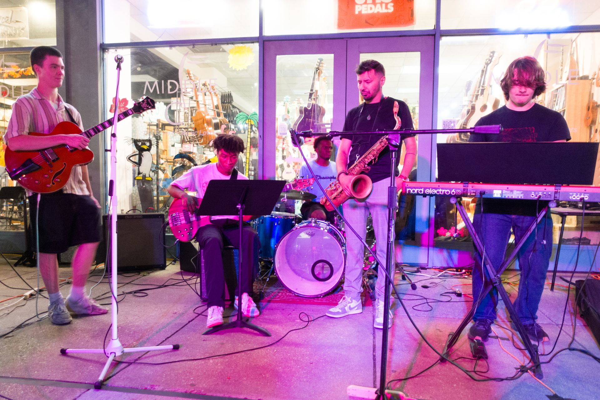 student band performing out in front of the store
