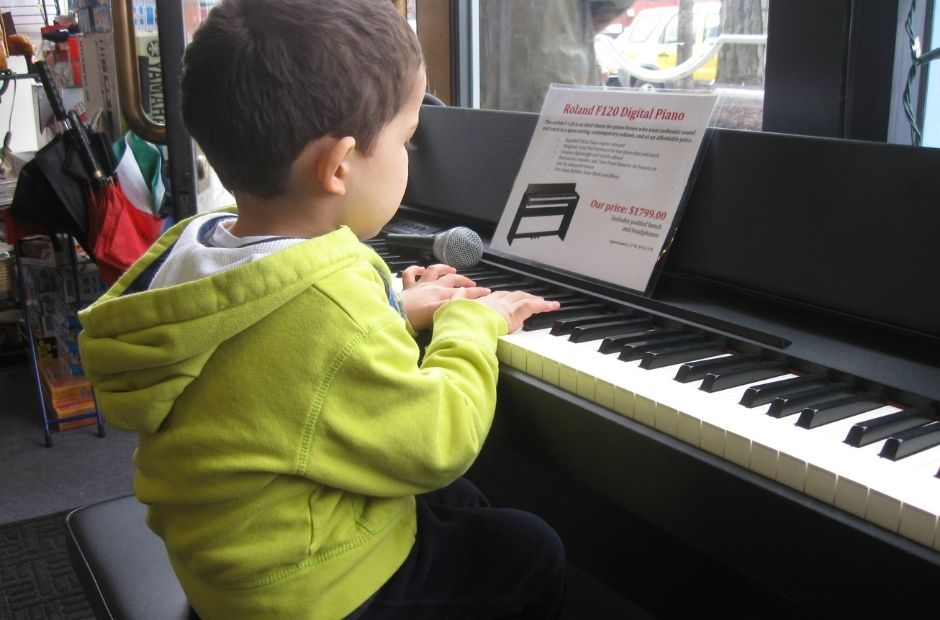 Young student playing the piano