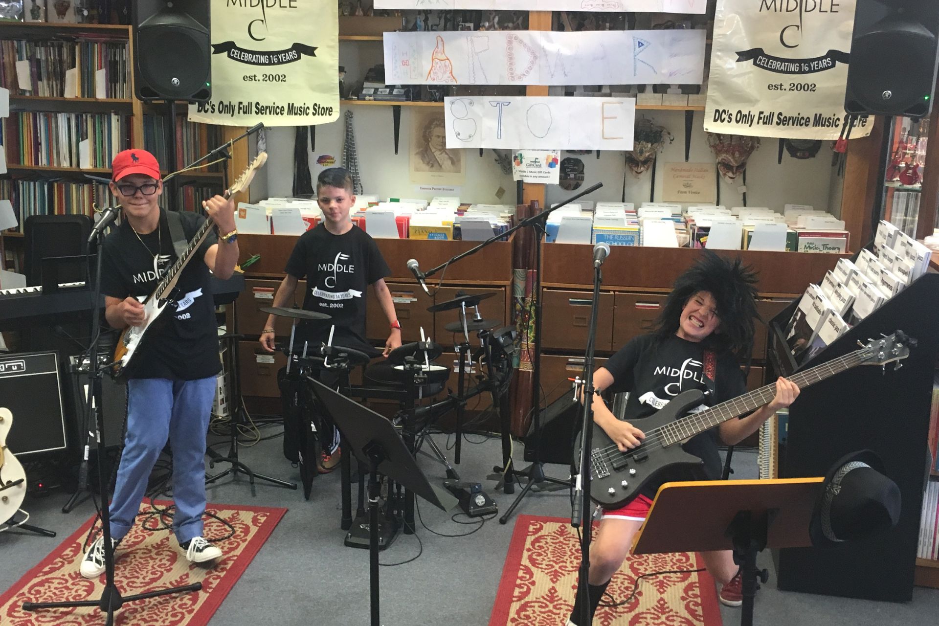 student band performing in the store posing with their instruments