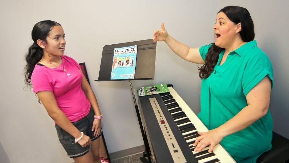 voice teacher and student in a lesson