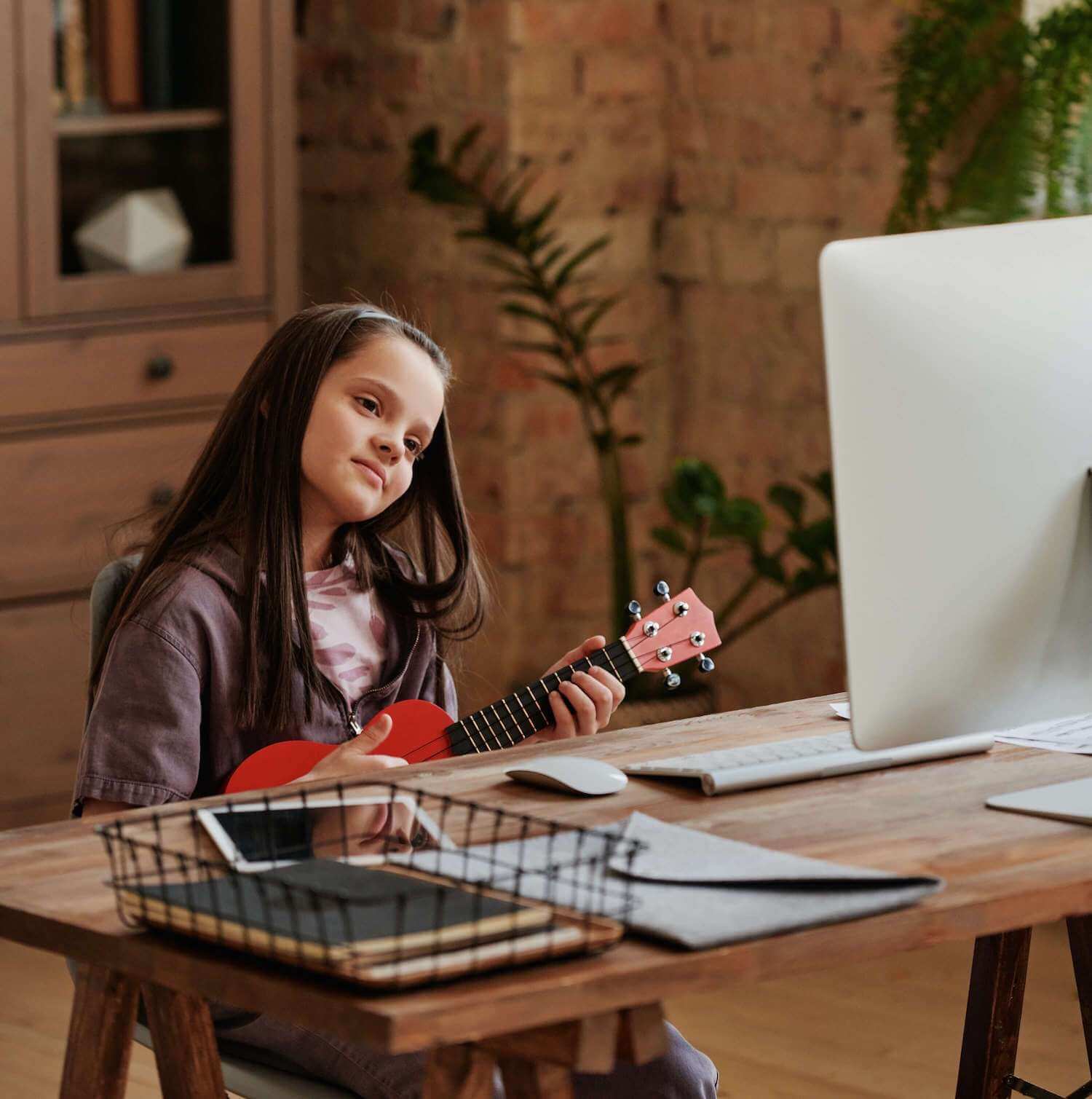 young student taking online guitar lessons Caldwell NJ