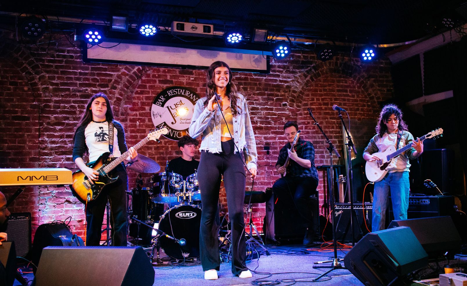 Students playing music on stage