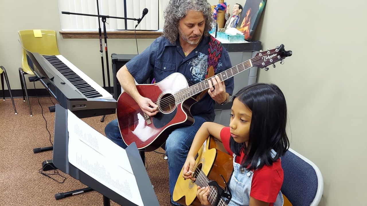 student learning guitar in Naperville, Illinois