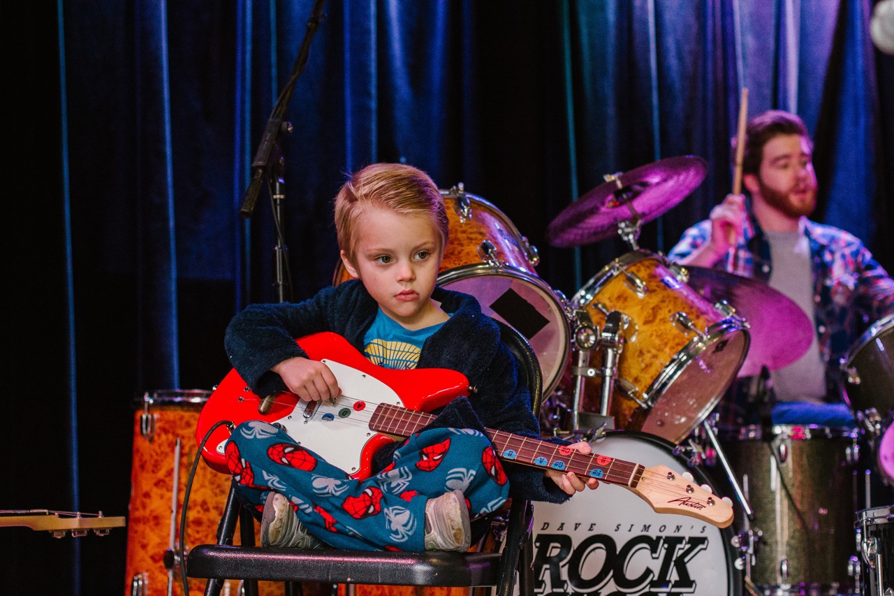 little girl playing guitar