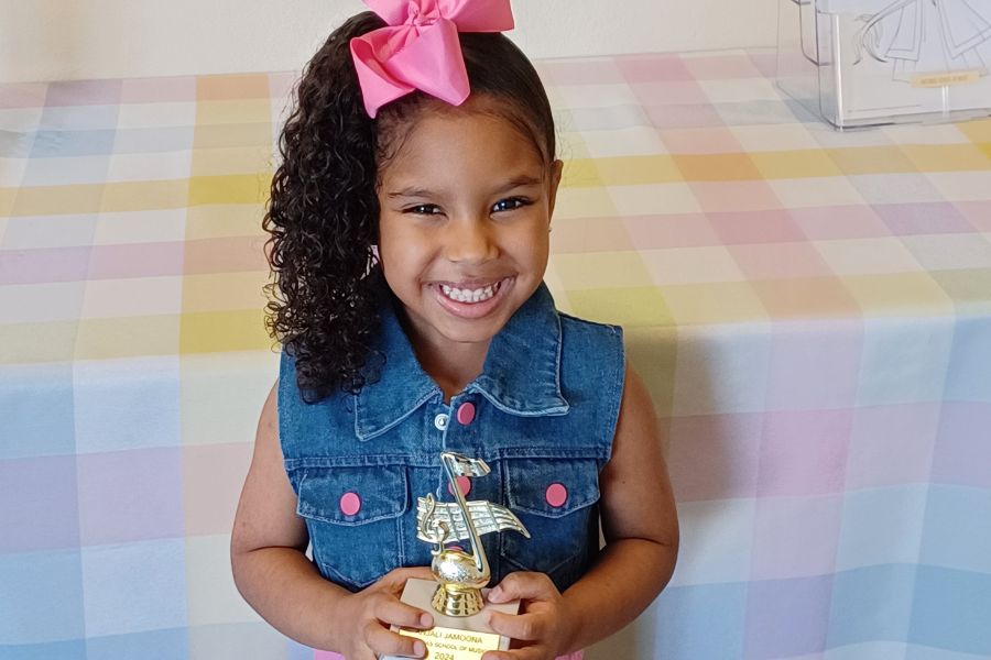 girl holding a trophy