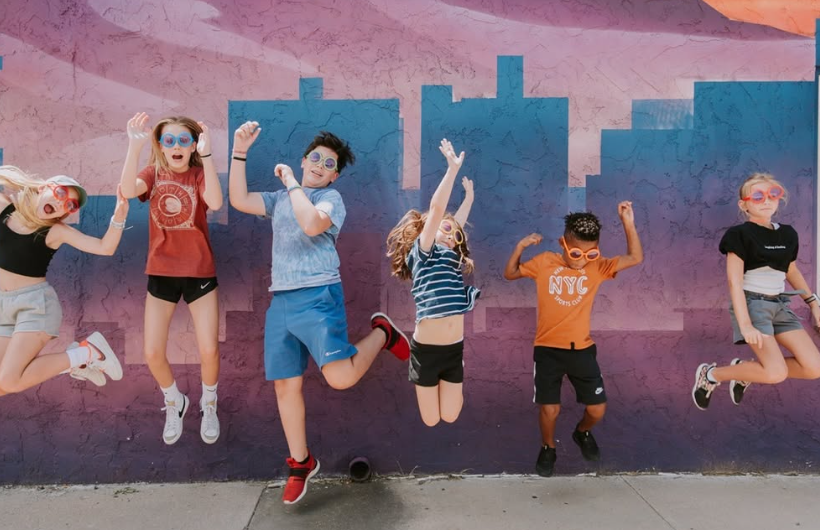 Group of students jumping in the air