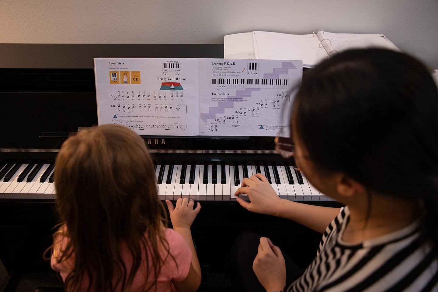 student learning to play the piano
