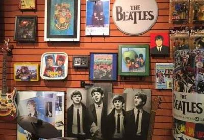 the Beatles photos on wall