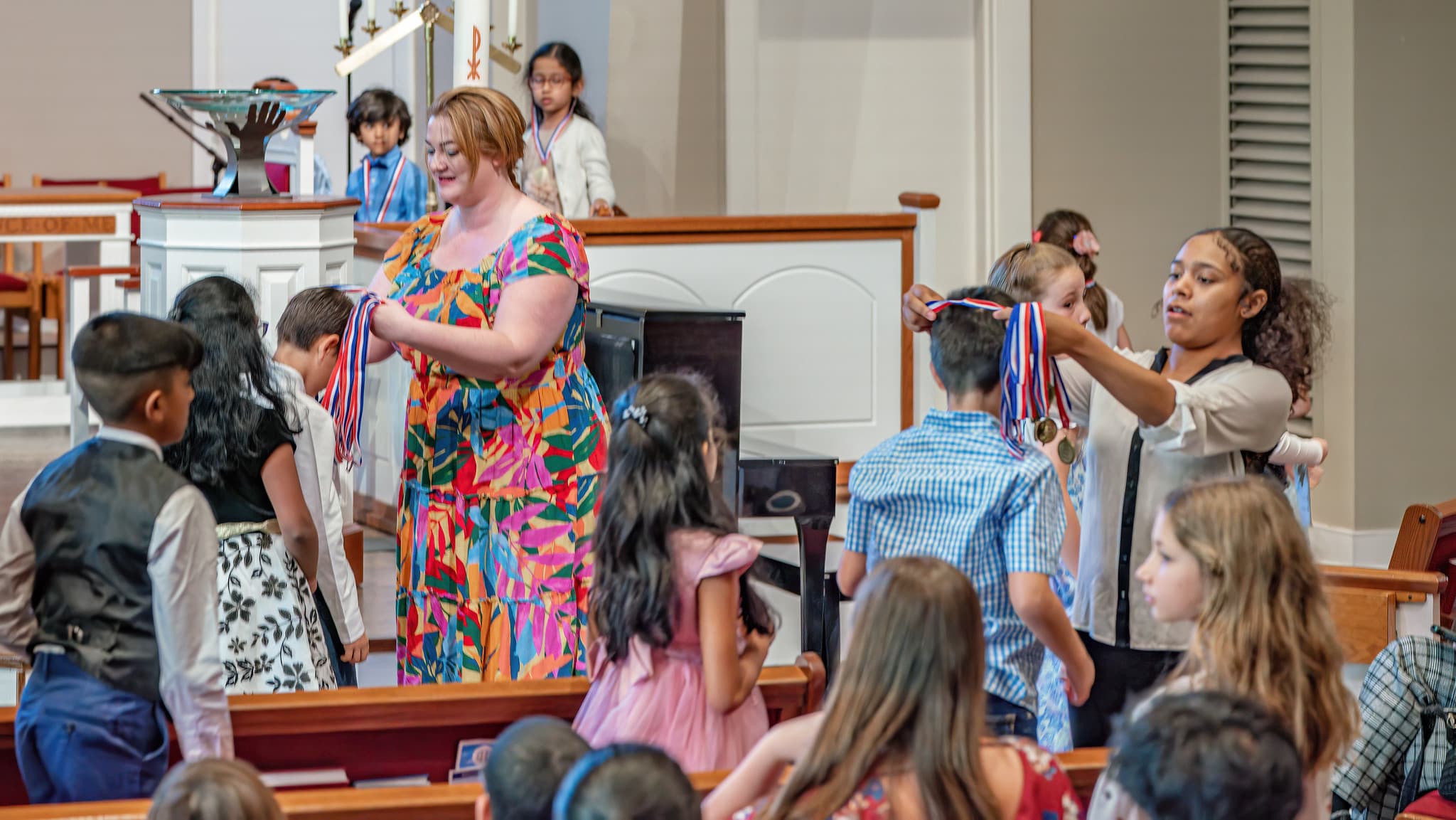 students getting medals at the recital