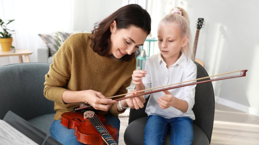 violin teacher and student at Rogers